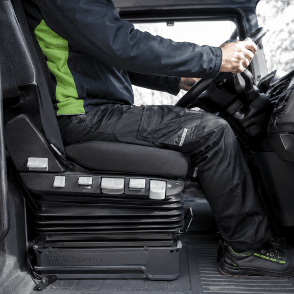 Truck seat suspension that reduces vibration and improves driver safety